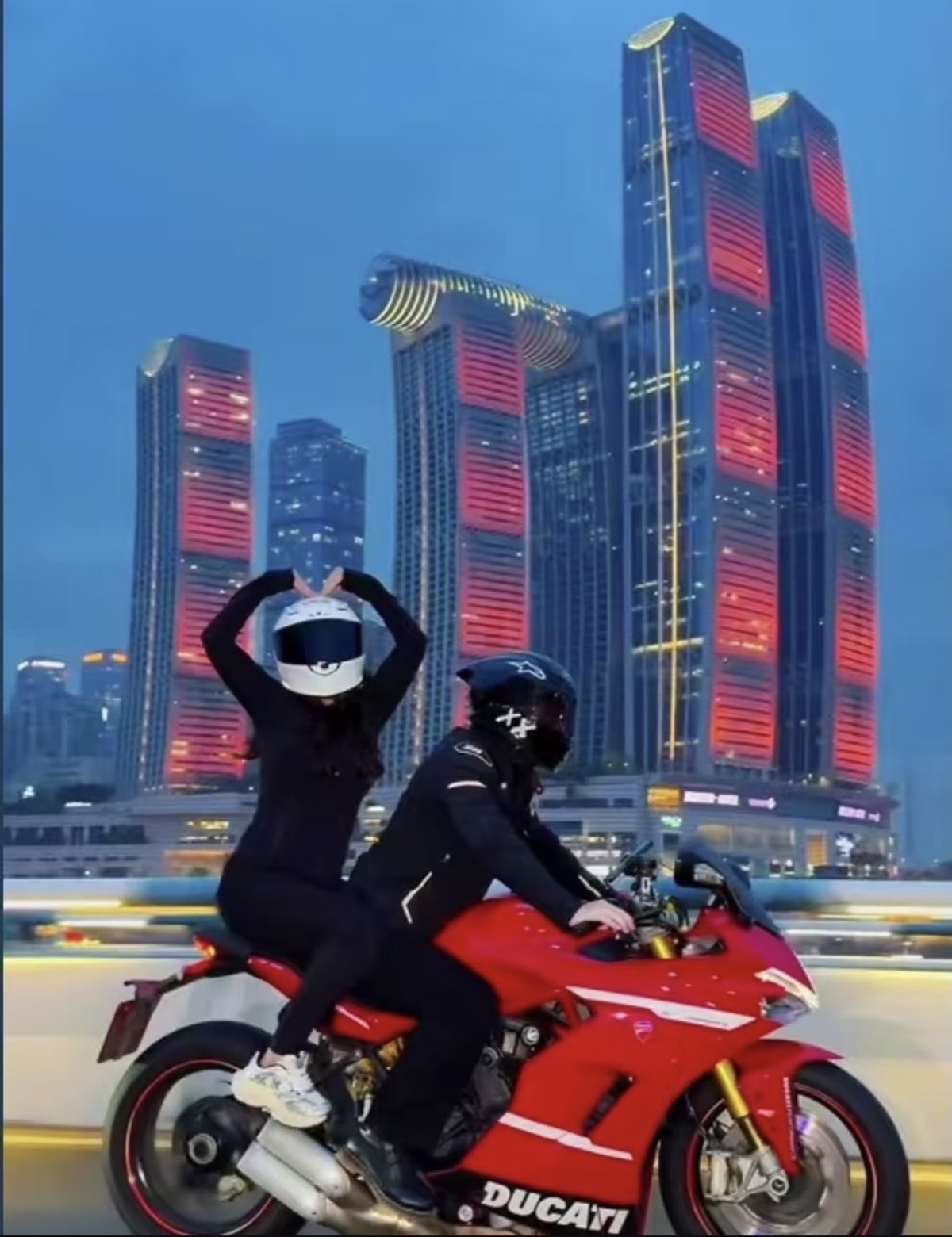 Cinematic motorbike portrait in a recognizable Chongqing night setting