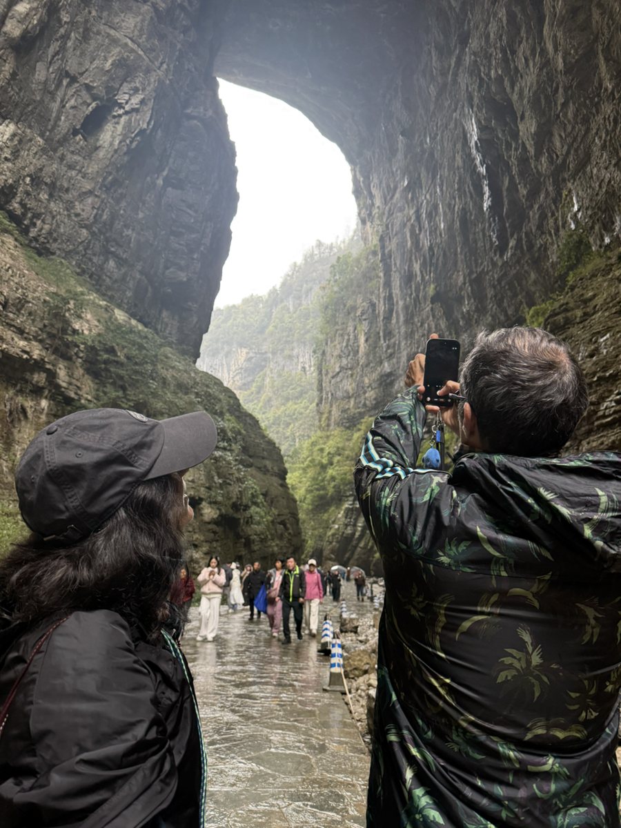 Guests walking through Wulong's dramatic karst gorge
